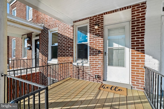 entrance to property with brick siding