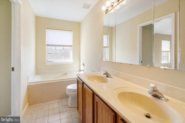 full bathroom featuring tile patterned flooring, a healthy amount of sunlight, and a sink