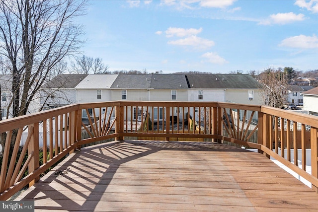 wooden deck with a residential view