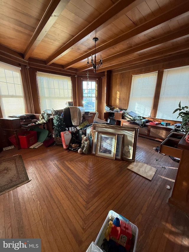 interior space with wood ceiling, beam ceiling, a notable chandelier, and wood finished floors