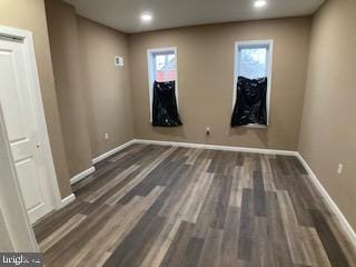 unfurnished room featuring dark wood-style floors, recessed lighting, and baseboards