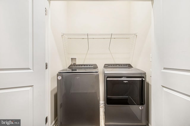 laundry area with laundry area and separate washer and dryer