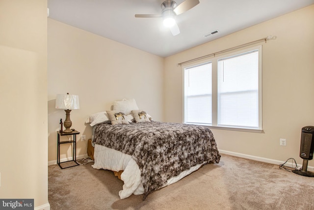 bedroom featuring carpet floors, visible vents, ceiling fan, and baseboards