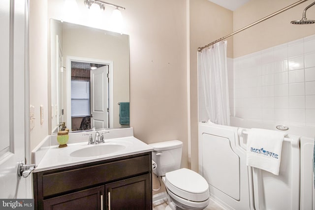 bathroom featuring shower / bath combo with shower curtain, vanity, and toilet