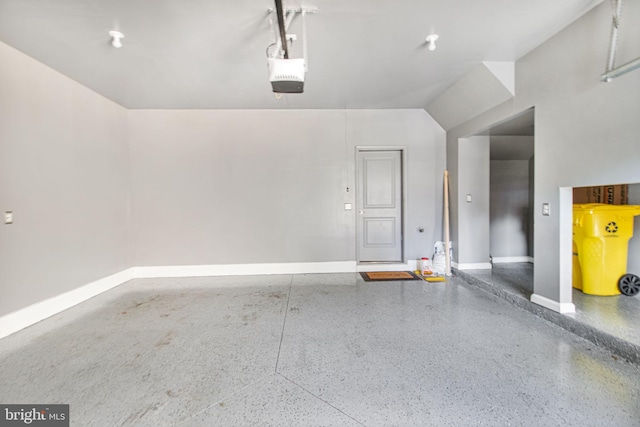 garage featuring baseboards and a garage door opener