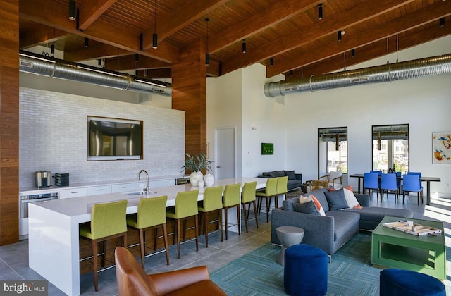interior space with a sink, outdoor lounge area, and outdoor wet bar