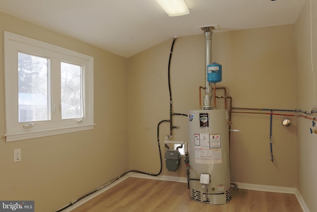 utility room featuring gas water heater