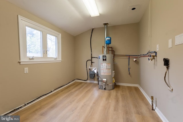 utility room featuring water heater