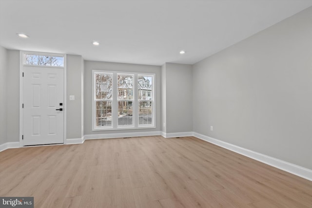 entrance foyer with light wood-type flooring, baseboards, and recessed lighting