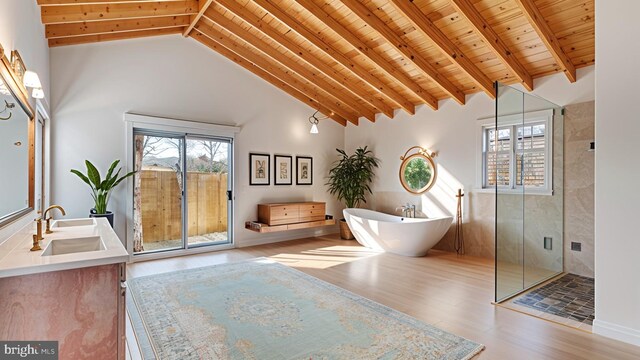 8322 Bayside Rd, Chesapeake Beach, MD 20732 - bathroom featuring wooden ceiling with exposed beams, wood finished floors, double vanity, a freestanding tub, and a stall shower