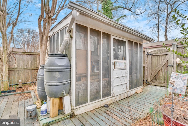 8322 Bayside Rd, Chesapeake Beach, MD 20732 - view of outbuilding with a gate and a sunroom