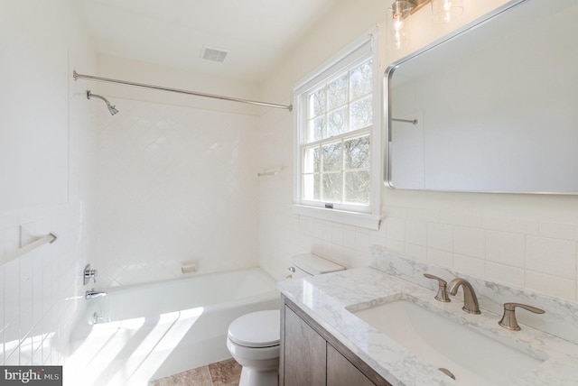 full bath featuring visible vents, toilet, shower / tub combination, tile walls, and vanity