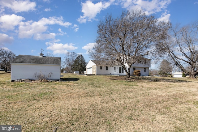 view of yard featuring a garage