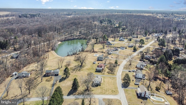 bird's eye view with a forest view and a water view