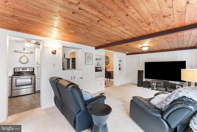 carpeted living area with built in features, wood ceiling, beamed ceiling, and a ceiling fan