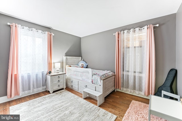 bedroom with wood finished floors