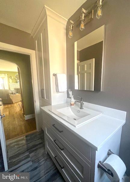 bathroom with vanity and wood finished floors