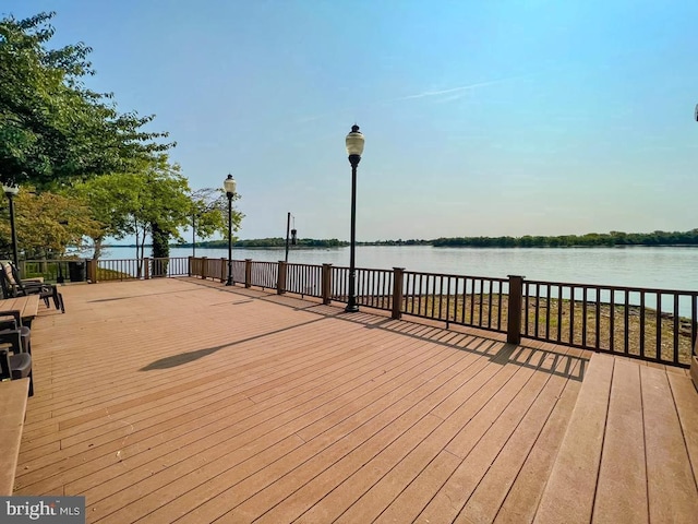 wooden deck featuring a water view