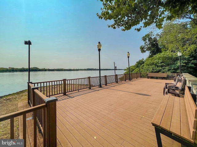 wooden terrace with a water view