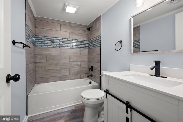 bathroom with vanity, shower / bathing tub combination, wood finished floors, and toilet