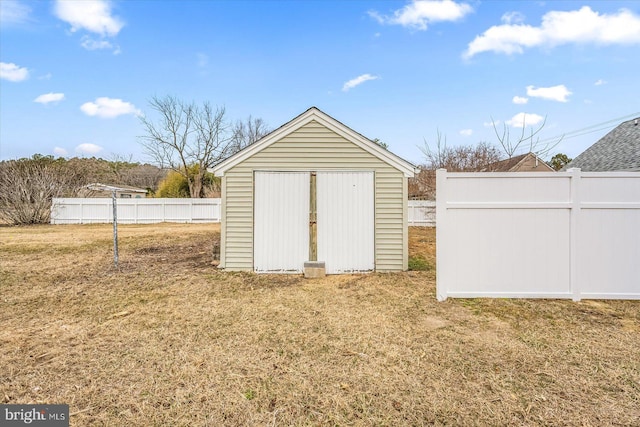 view of shed featuring fence