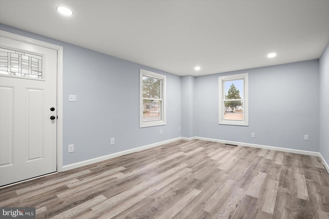 entryway featuring recessed lighting, wood finished floors, visible vents, and baseboards