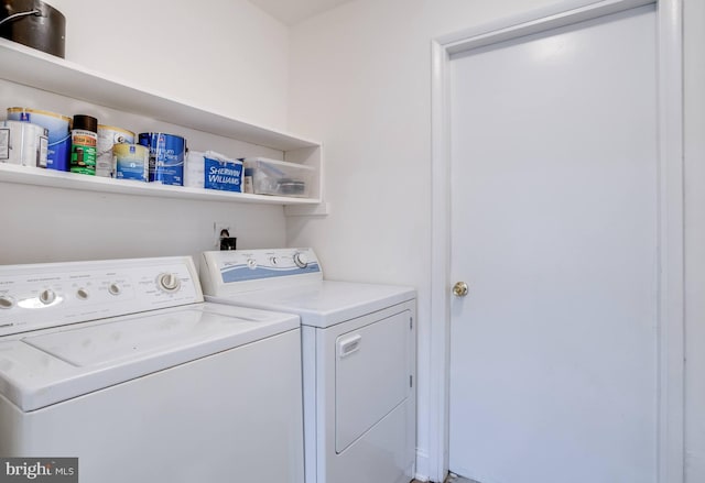 washroom with laundry area and independent washer and dryer