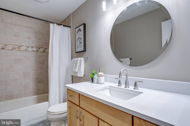 bathroom with toilet, shower / tub combo with curtain, and vanity