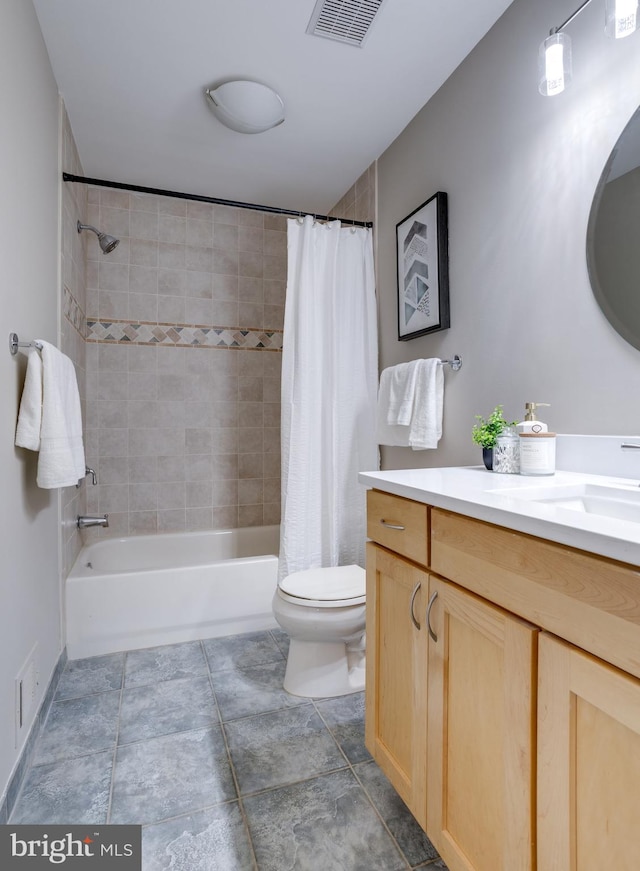 full bath featuring toilet, vanity, visible vents, and shower / tub combo with curtain