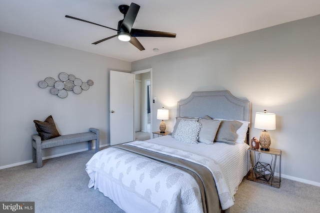 bedroom with carpet floors, ceiling fan, and baseboards