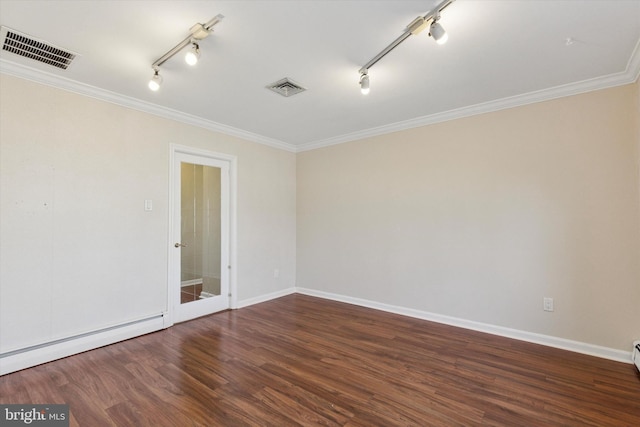 empty room with a baseboard heating unit, visible vents, dark wood finished floors, and crown molding