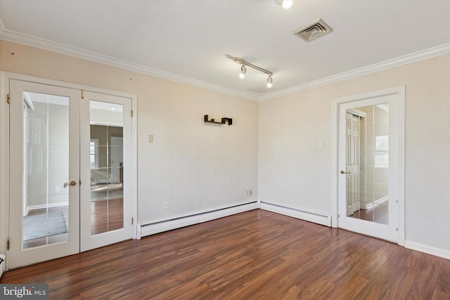 empty room featuring visible vents, dark wood-style floors, baseboard heating, crown molding, and french doors