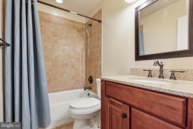 bathroom featuring shower / bath combo, tile patterned flooring, vanity, and toilet