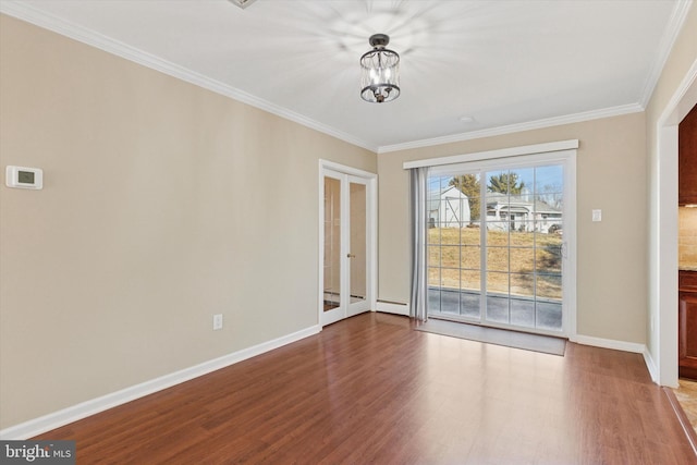 empty room featuring ornamental molding, a chandelier, baseboards, and light wood finished floors