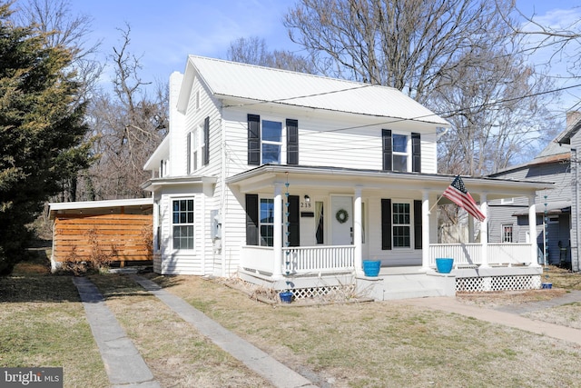 view of front facade with a porch and metal roof