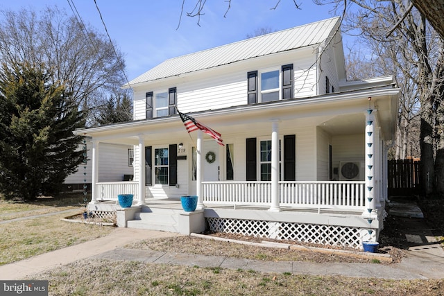 view of front of house with covered porch and metal roof