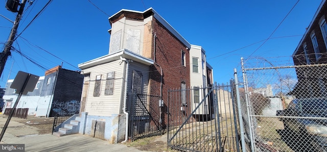 view of home's exterior with fence