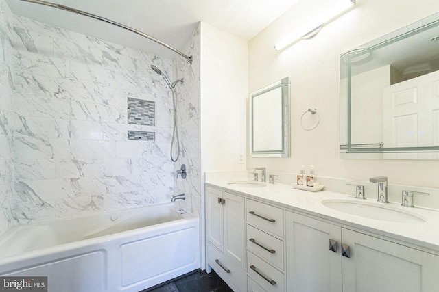 bathroom featuring shower / washtub combination, a sink, and double vanity