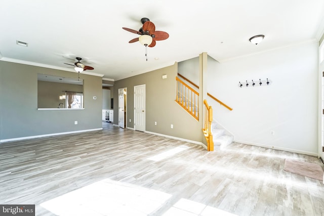 unfurnished living room featuring stairs, visible vents, and ornamental molding