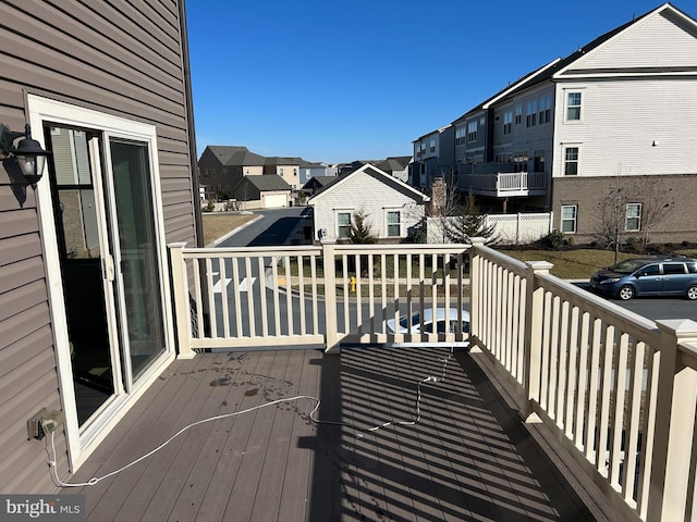 wooden terrace featuring a residential view