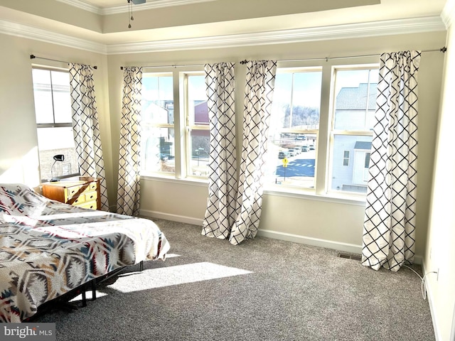 bedroom featuring baseboards, carpet floors, visible vents, and crown molding