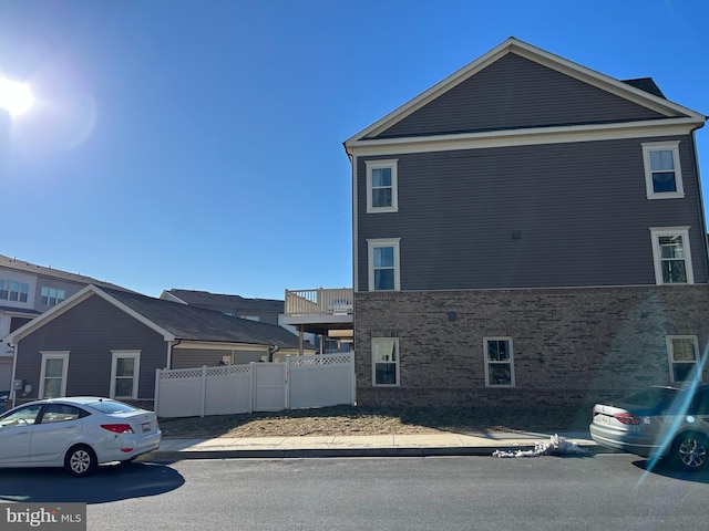 view of property exterior featuring fence