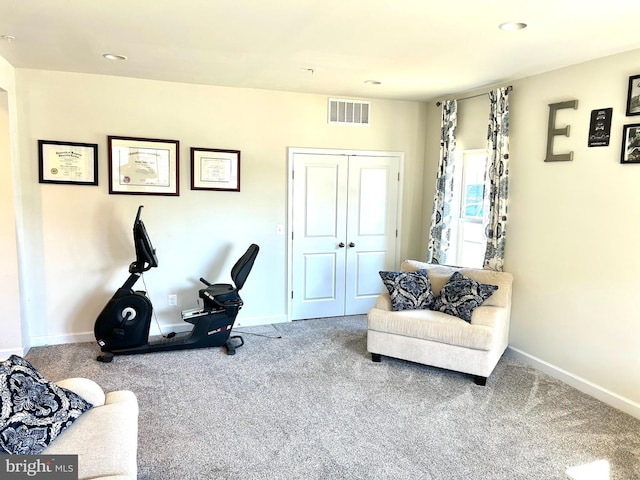 living area with carpet floors, recessed lighting, visible vents, and baseboards