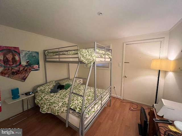 bedroom featuring wood finished floors