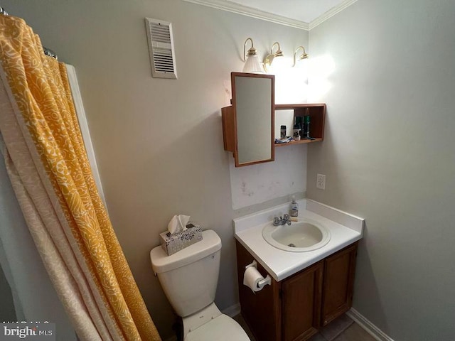 bathroom featuring toilet, vanity, visible vents, and baseboards