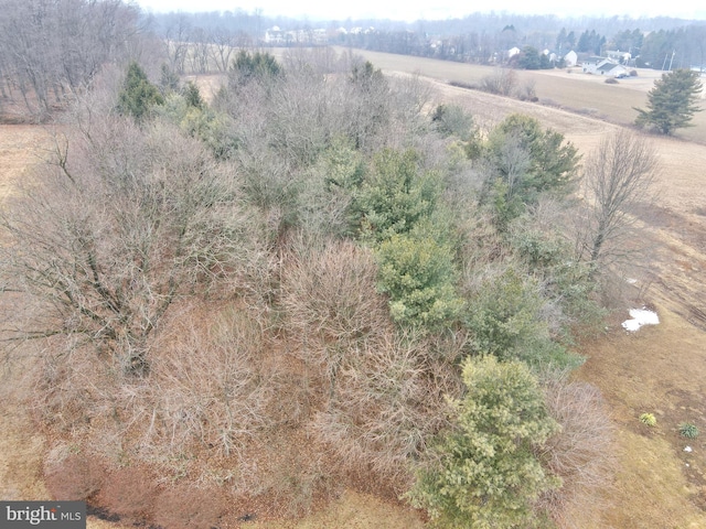 birds eye view of property featuring a rural view