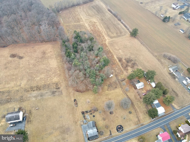 birds eye view of property with a rural view