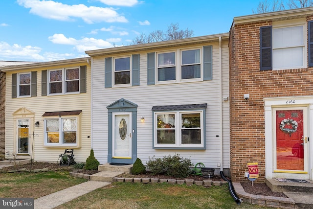 townhome / multi-family property featuring brick siding