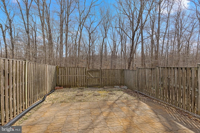 view of patio with a gate and a fenced backyard