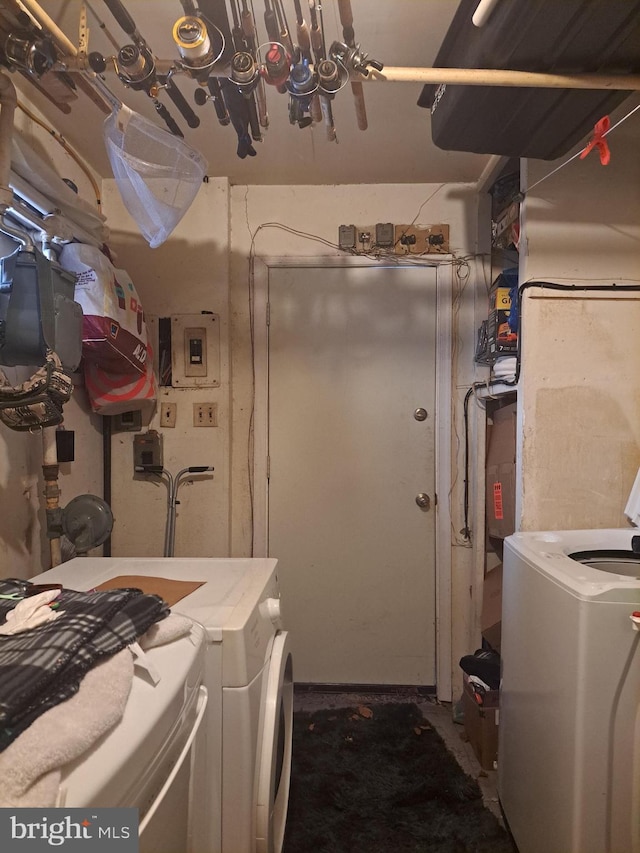 laundry area with electric panel, laundry area, and independent washer and dryer